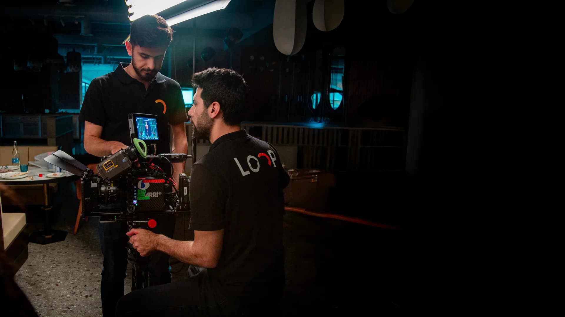 Loop crew filming on set with an ARRI cinema camera
